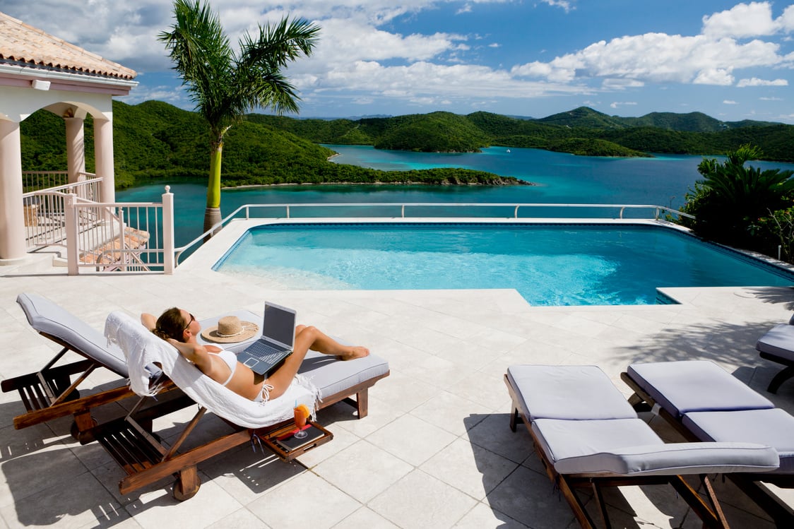 sunbathing woman on luxury vacation in the Caribbean