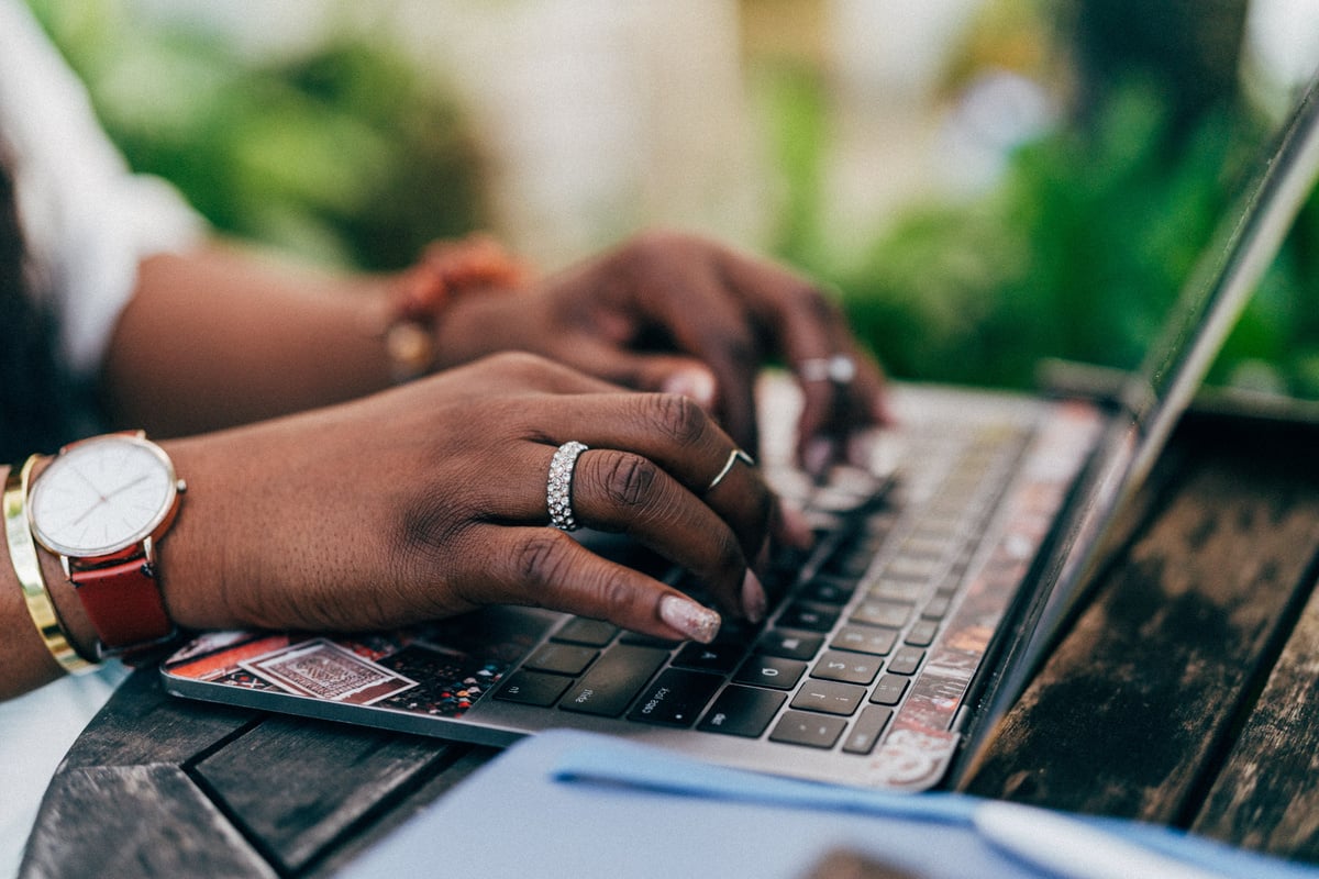 Woman Typing on Laptop