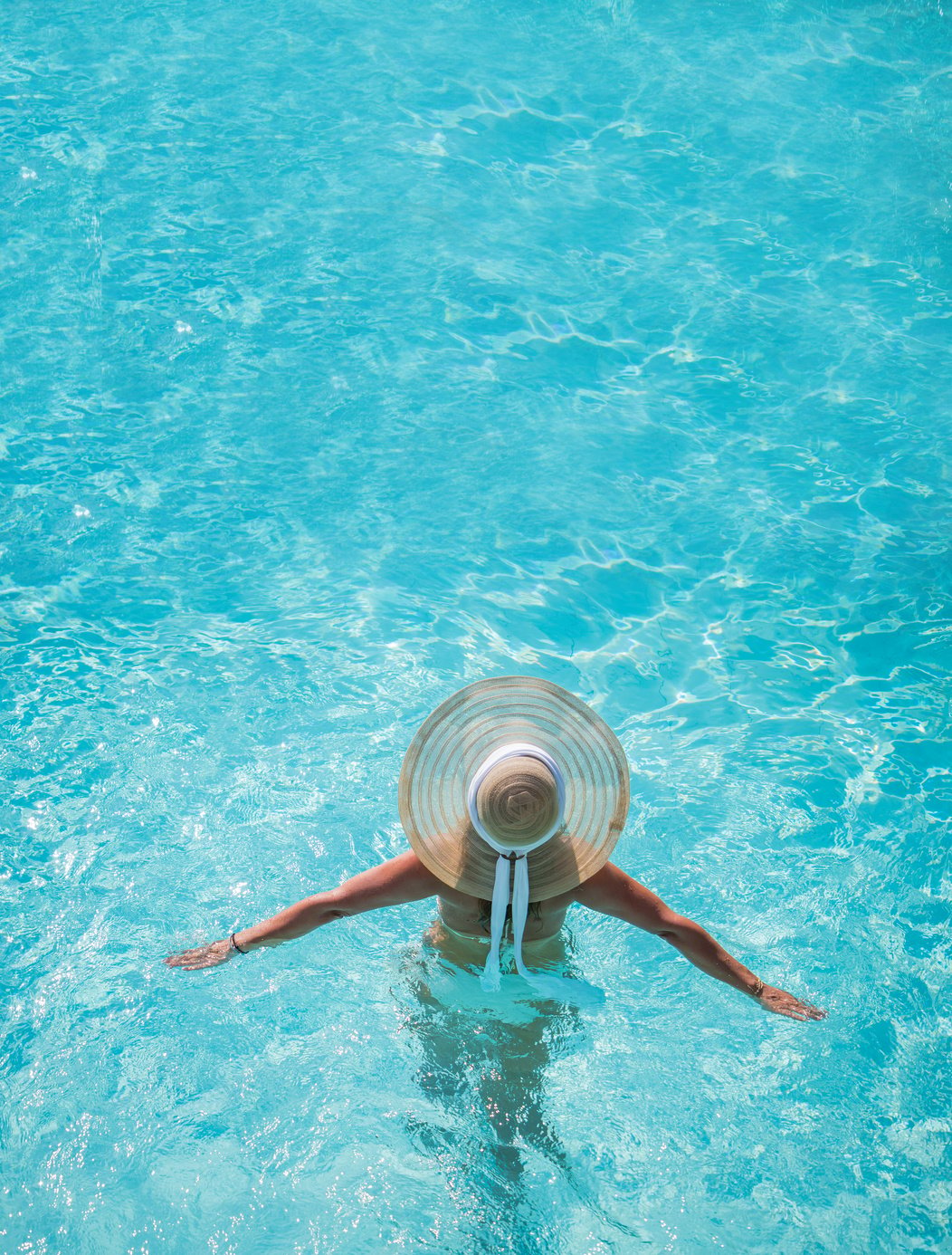 Young Woman Wearing a Straw Hat